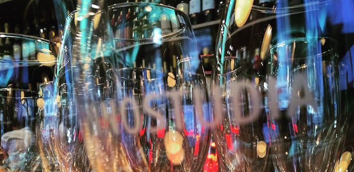 an empty glass of wine in a bar